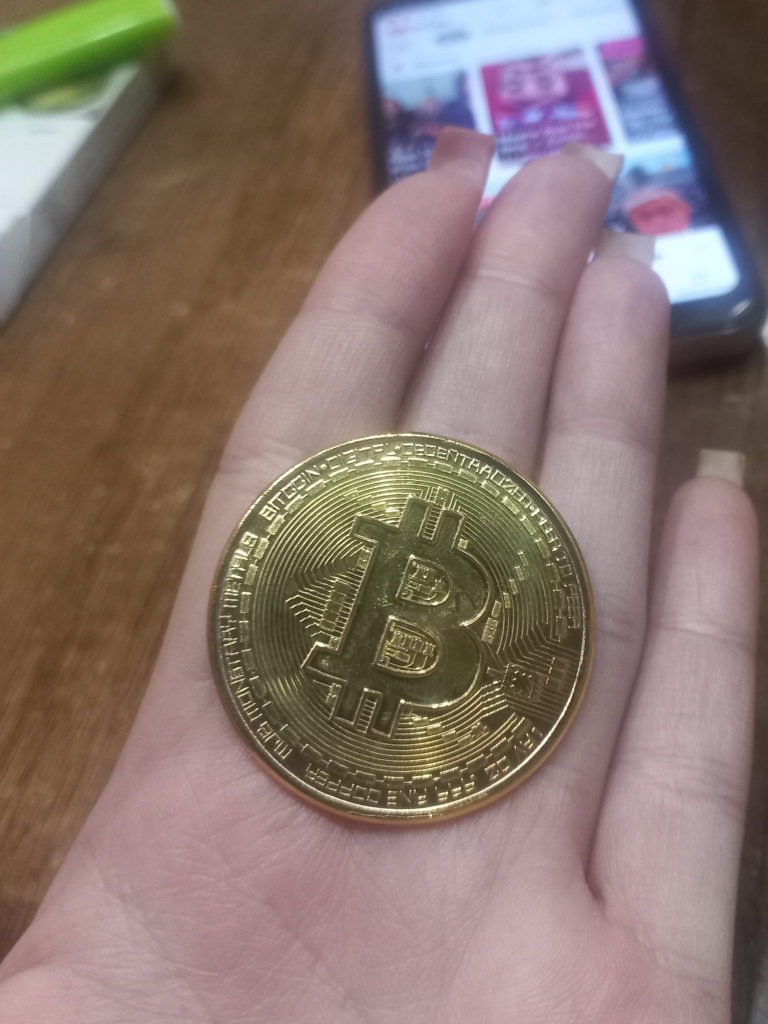 Bitcoin Gold Coin in Hand
